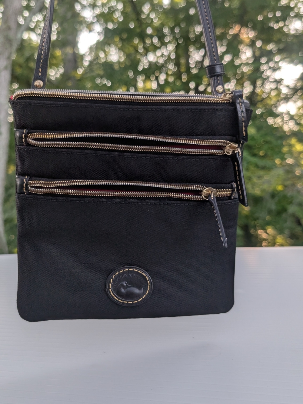 Dooney & Bourke Black Crossbody Bag with Gold Zippers